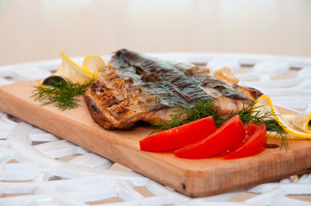high quality jpeg example - fish on a board with tomatoes and delicate lemon slices